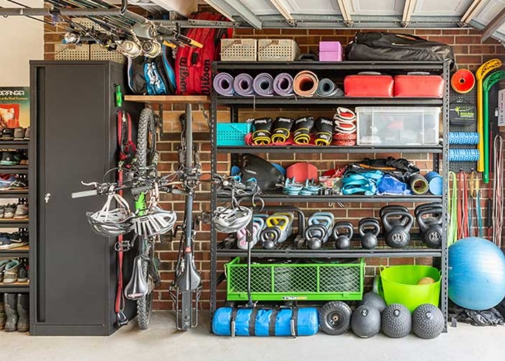 Garage with home gym set up and storage